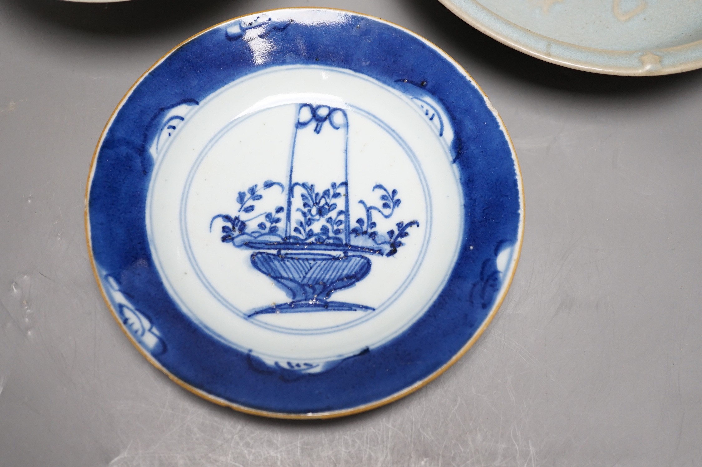 A group of three Chinese ceramics; a Qing Bai style bowl, a Jun style bowl with dragon relief decor and inscription to base, and a blue and white dish, tallest 6cm